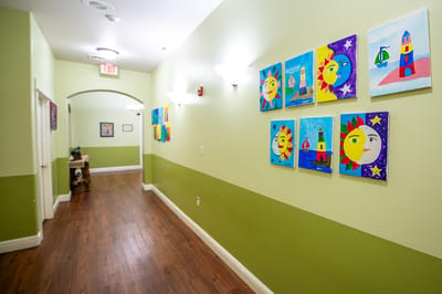 Colorful artwork displayed in a hallway