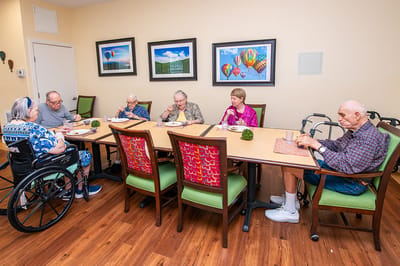Residents enjoying a meal in the dining room