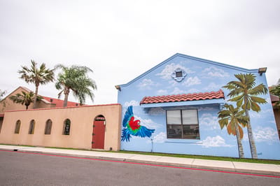 Exterior of a facility with colorful mural