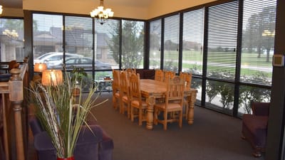Interior view of a common area with dining table and seating