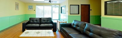 Bright common area with seating and natural light