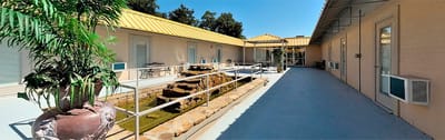 Outdoor courtyard with seating and water feature