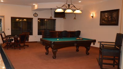 Interior view of a game room with a pool table