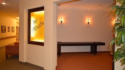 Interior view of a facility common area with signage
