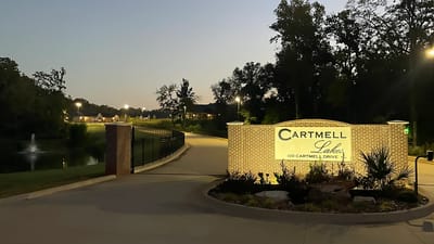 Entrance sign to Cartmell Lakes facility at dusk
