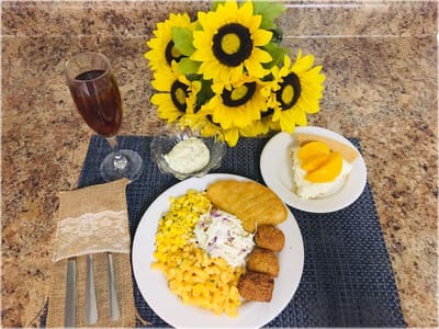 Delicious meal served in a dining area with flowers