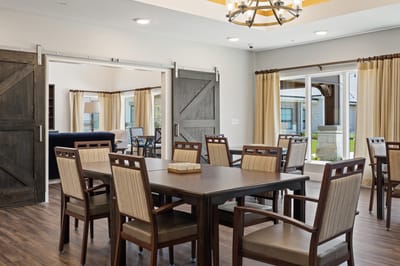 Bright common area with tables and chairs