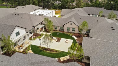 Aerial view of a landscaped outdoor space in a senior living facility