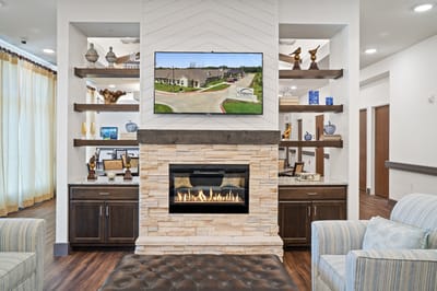Interior view of a lounge with fireplace and TV