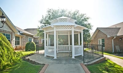 Outdoor gazebo surrounded by greenery