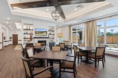 Bright common area with seating and large windows