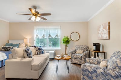 Bright and welcoming living area in an assisted living facility.