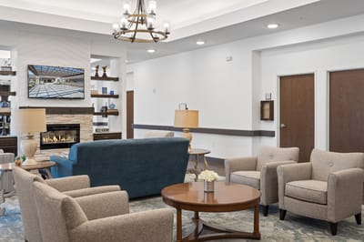 Comfortable common area with seating and a fireplace