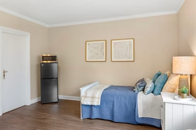 Cozy private room with a bed and decor