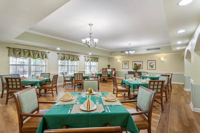 Bright dining room with elegantly set tables
