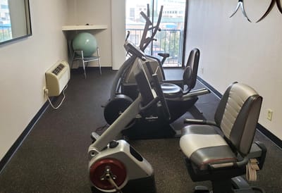 Fitness equipment in a well-lit interior room