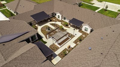 Aerial view of landscaped outdoor space in a senior living facility