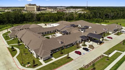 Aerial view of the senior living facility and surrounding area