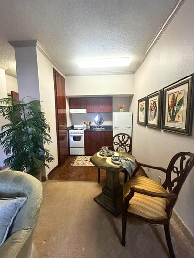 Cozy interior of a resident room with a kitchenette