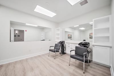 Interior of a beauty salon with chairs and mirrors