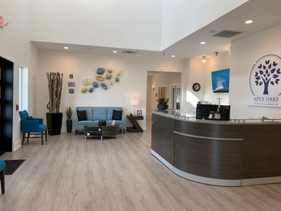 Bright and welcoming lobby with modern decor and seating areas.