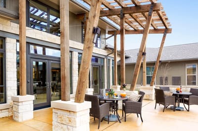 Outdoor seating area with tables and chairs