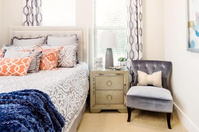 Cozy resident bedroom setup with a bed and chair