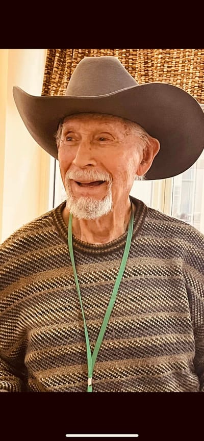 Smiling senior man wearing a large cowboy hat
