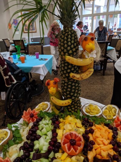 Colorful fruit display at a dining event with residents