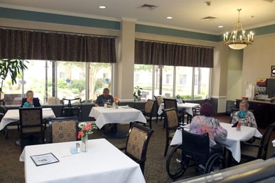 Residents enjoying a meal in the dining room