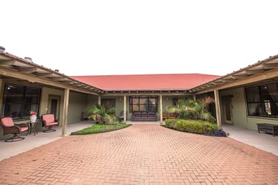 Outdoor courtyard area with seating and landscaping