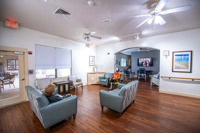 Residents socializing in a common area with seating