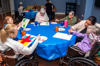 Residents participating in an art activity at a table