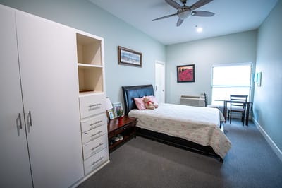 Cozy private resident room with a bed and decor