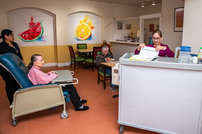 Residents engaging in an activity in a vibrant common area