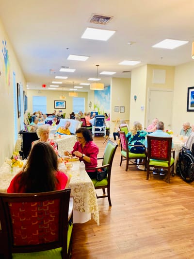 Residents enjoying a meal in the dining room
