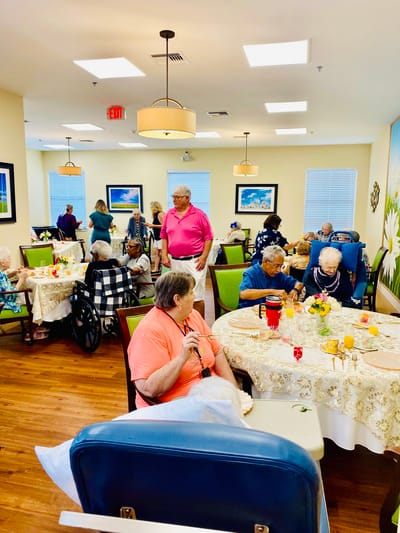 Dining room with residents enjoying meals and socializing