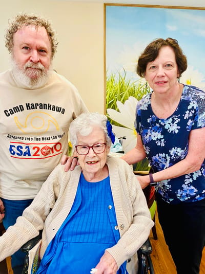 Residents and staff celebrating together indoors
