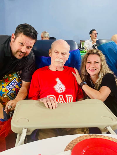 Residents celebrating with family in a common area
