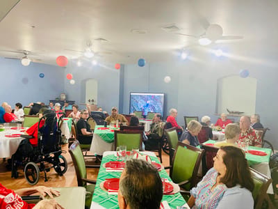 Residents enjoying a festive gathering in the dining area