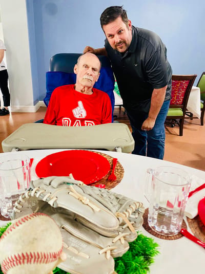 Resident and staff member enjoying a celebratory event