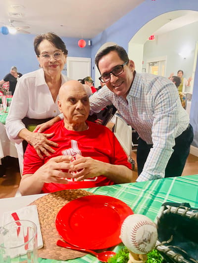 Residents enjoying a meal in a festive dining area