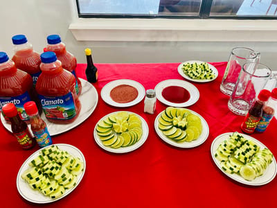 Plates of sliced limes and cucumbers with drinks