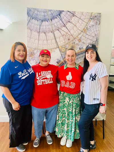 Staff and residents celebrating in a common area