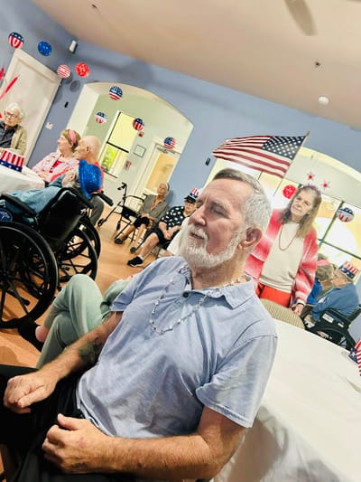 Residents celebrating in a common area with decorations.