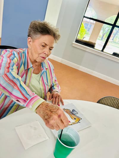Senior resident engaged in an arts and crafts activity
