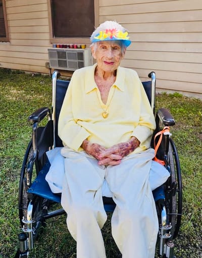 Resident in a wheelchair enjoying the outdoors