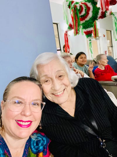 Residents enjoying a celebration with staff