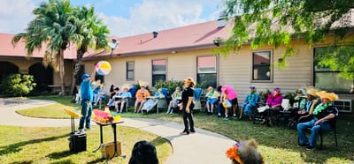 Residents enjoying an outdoor activity with entertainment