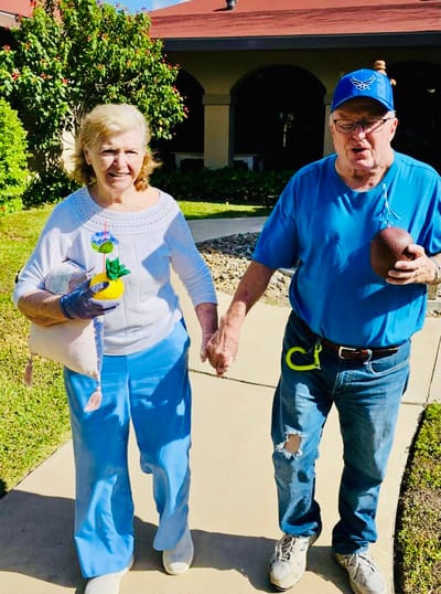 Residents enjoying a sunny outdoor walk together